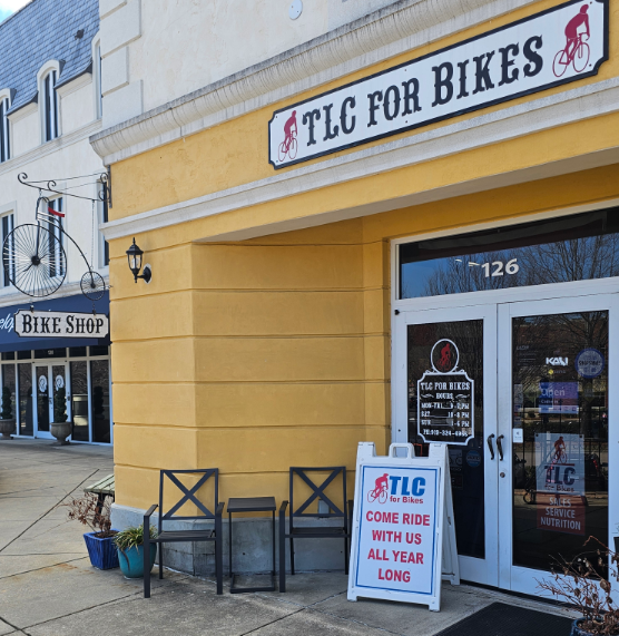 tlc banner man bicycle cyclist in trouble of front tire wheel on accident clashed, needs repair and by workshop, drag and pull bicycle away with mind upset